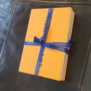 Louis Vuitton medium wallet gift box with ribbon.